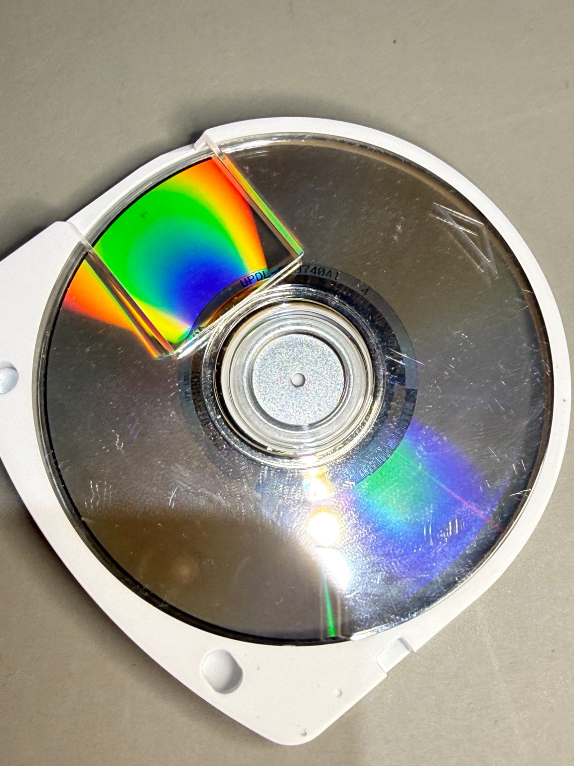 Daxter PSP UMD disc surface with visible wear
