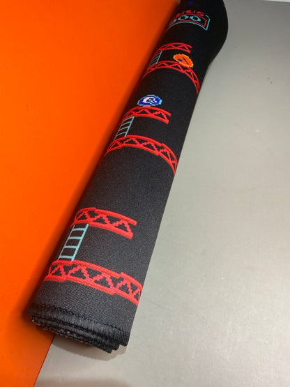 Donkey Kong desk mat rolled to show flexibility